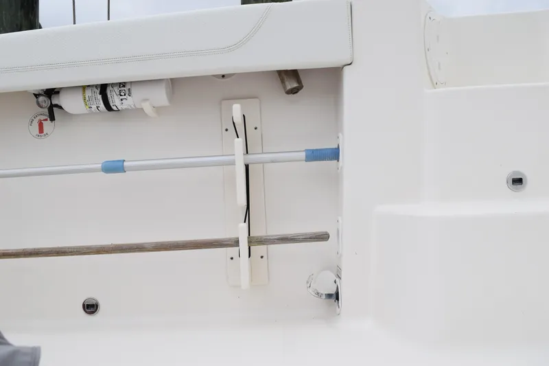  Yacht Photos Pics 2022 Pursuit OS 355 Offshore boat interior with safety equipment and storage features.