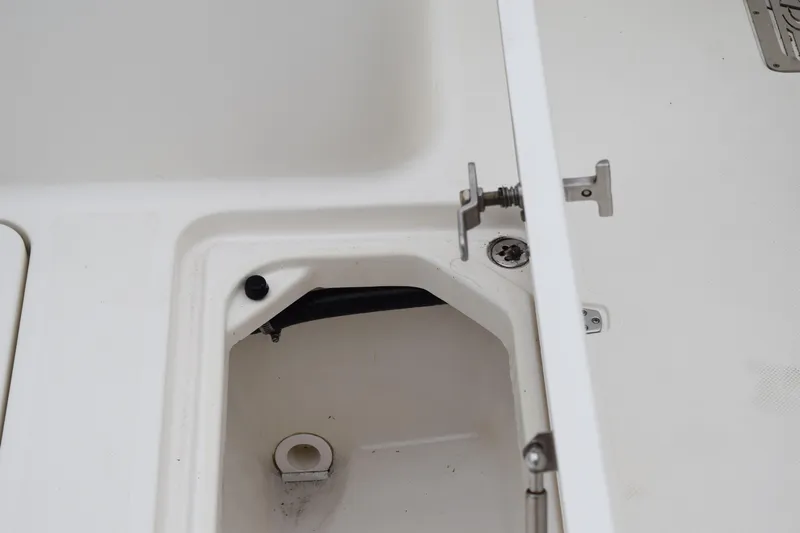 Yacht Photos Pics 2022 Pursuit OS 355 Offshore boat compartment detail with latch mechanism.