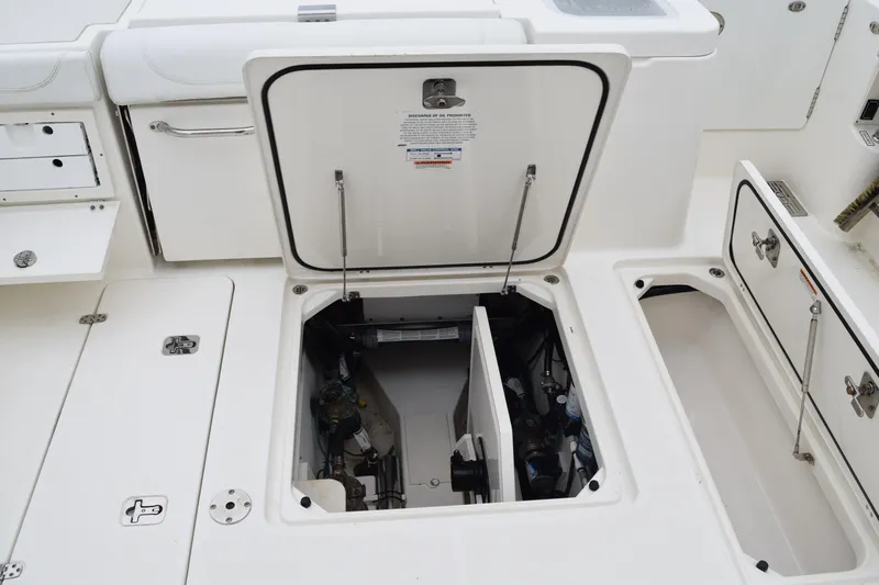  Yacht Photos Pics 2022 Pursuit OS 355 Offshore boat storage compartments and access hatches open.