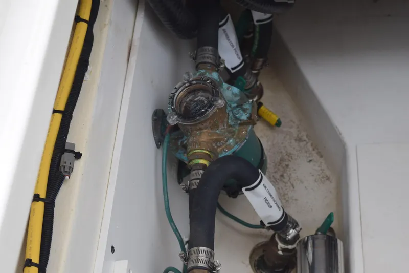  Yacht Photos Pics 2022 Pursuit OS 355 Offshore boat engine compartment with hoses and wiring.