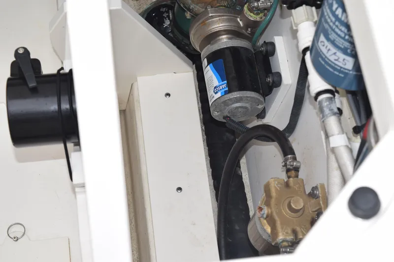  Yacht Photos Pics Engine compartment of 2022 Pursuit OS 355 Offshore boat, showcasing mechanical components.