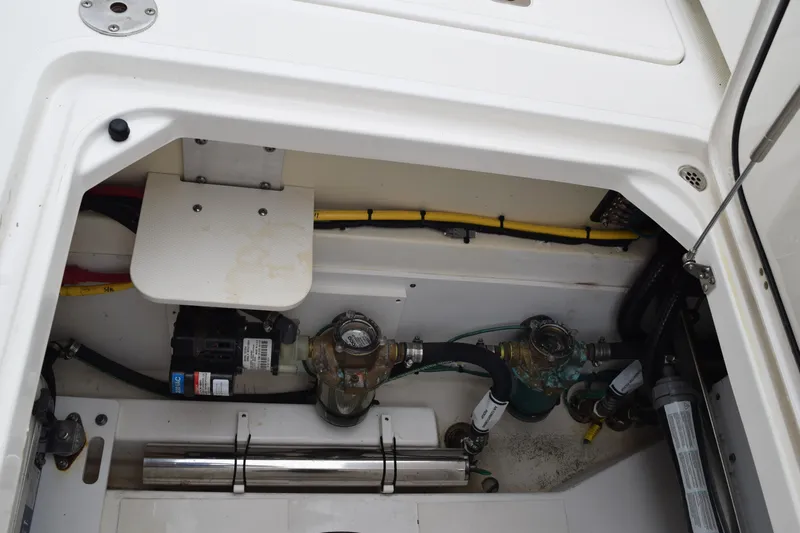  Yacht Photos Pics 2022 Pursuit OS 355 Offshore engine compartment with visible wiring and components.