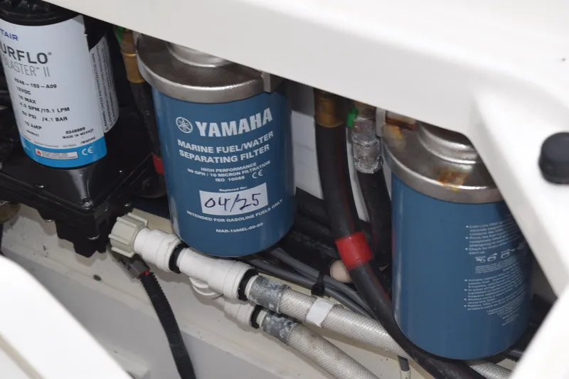  Yacht Photos Pics Engine compartment of 2022 Pursuit OS 355 Offshore with Yamaha marine fuel filter.
