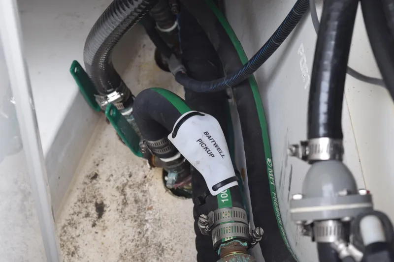  Yacht Photos Pics 2022 Pursuit OS 355 Offshore boat plumbing system with hoses and clamps.