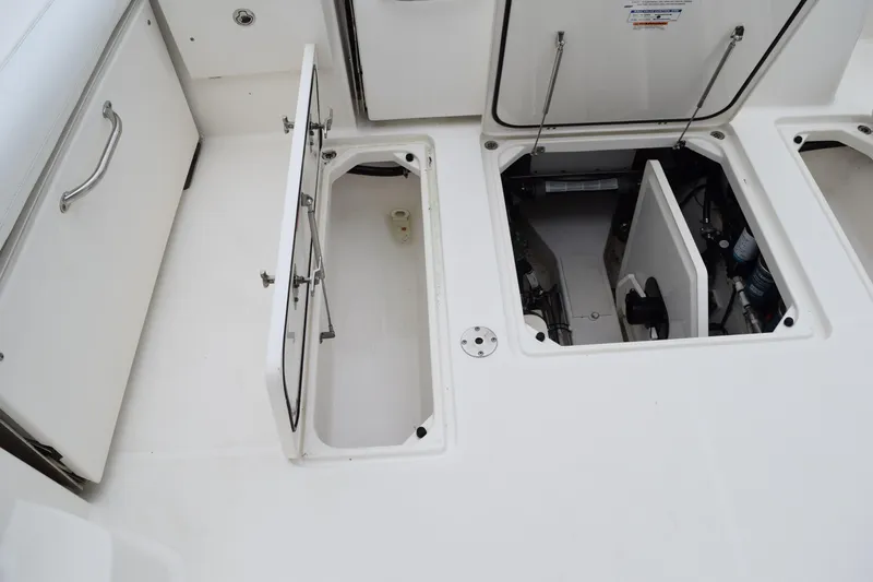  Yacht Photos Pics 2022 Pursuit OS 355 Offshore boat storage compartments and access hatches.