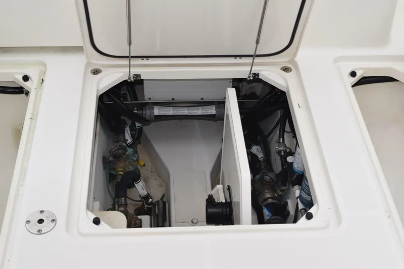  Yacht Photos Pics 2022 Pursuit OS 355 Offshore engine compartment with visible mechanical components.