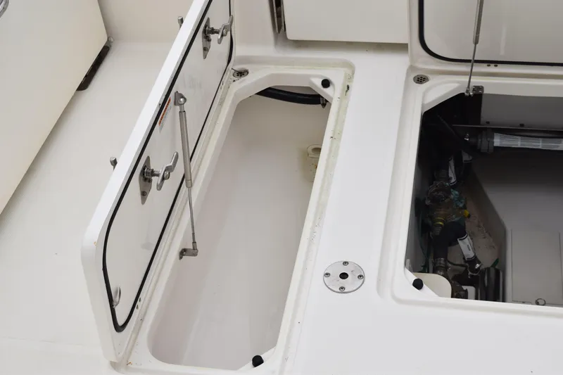  Yacht Photos Pics 2022 Pursuit OS 355 Offshore boat storage compartments and mechanical access.
