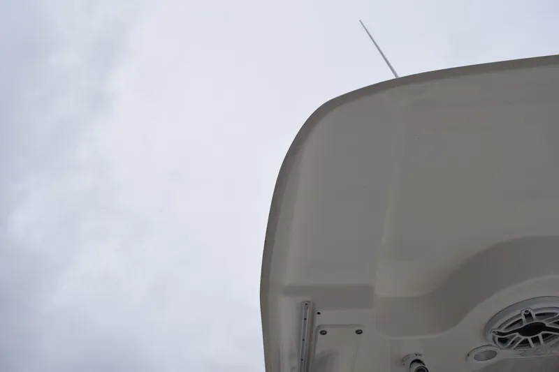  Yacht Photos Pics 2022 Pursuit OS 355 Offshore boat roof against cloudy sky.