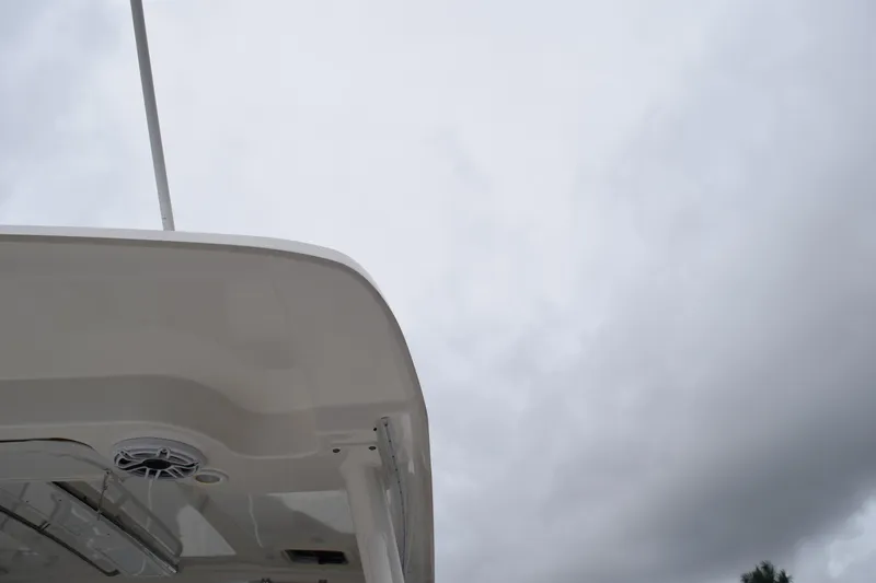  Yacht Photos Pics 2022 Pursuit OS 355 Offshore boat against cloudy sky background.