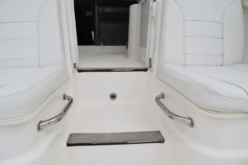  Yacht Photos Pics 2022 Pursuit OS 355 Offshore boat interior with white seating and stainless steel handles.