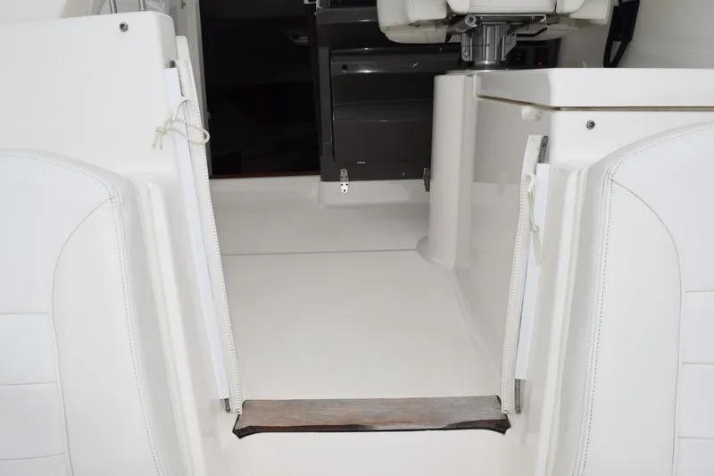  Yacht Photos Pics 2022 Pursuit OS 355 Offshore boat interior with white seating and helm area.