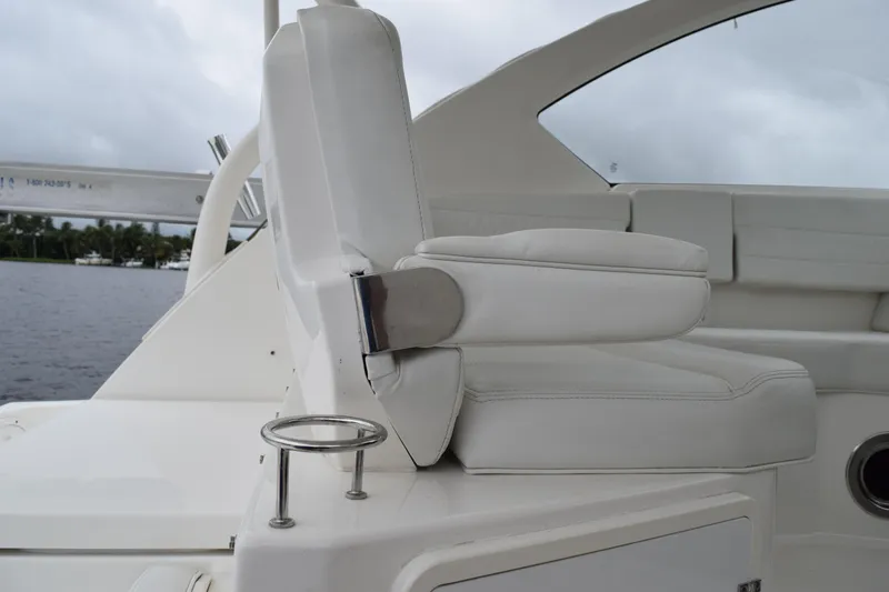  Yacht Photos Pics 2022 Pursuit OS 355 Offshore boat seat with cup holder, white leather upholstery.