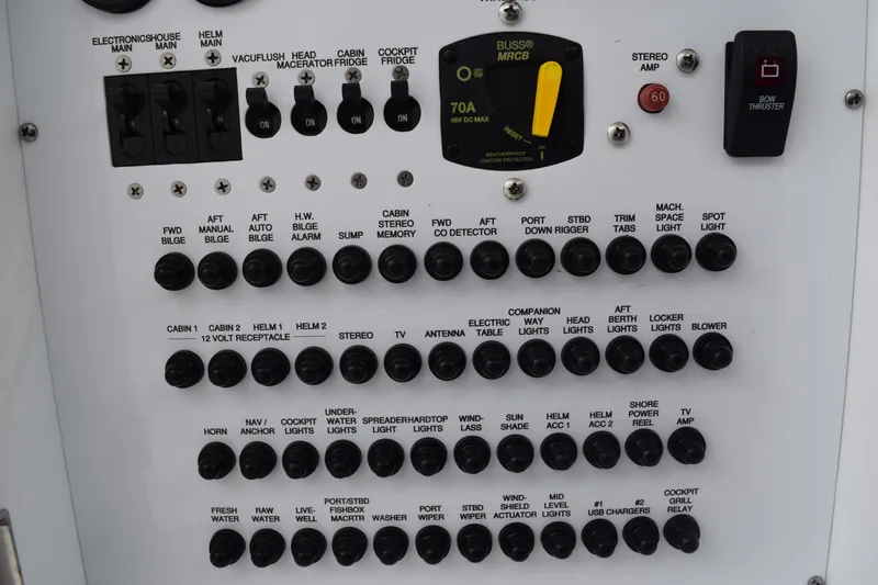  Yacht Photos Pics Control panel of a 2022 Pursuit OS 355 Offshore boat with various switches and indicators.