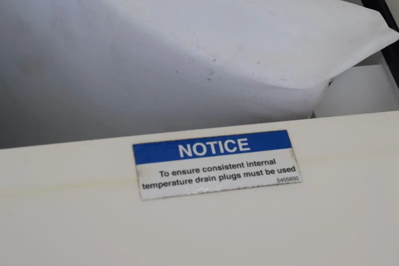  Yacht Photos Pics Notice label on 2022 Pursuit OS 355 Offshore, ensuring internal temperature consistency.