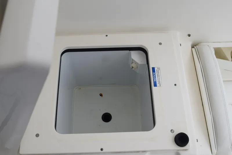  Yacht Photos Pics 2022 Pursuit OS 355 Offshore boat storage compartment, open and empty.