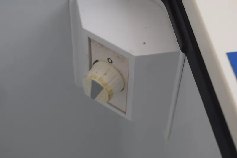  Yacht Photos Pics Close-up of a control knob on a 2022 Pursuit OS 355 Offshore boat.