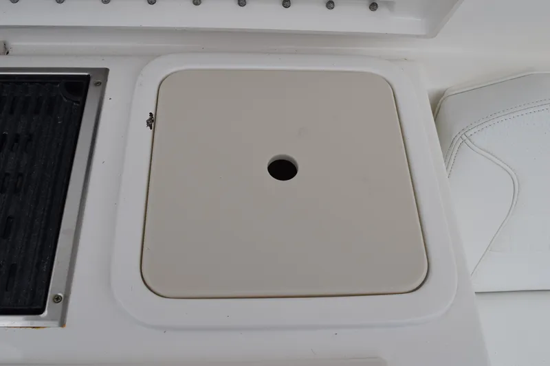  Yacht Photos Pics 2022 Pursuit OS 355 Offshore boat deck with storage compartment and seating.