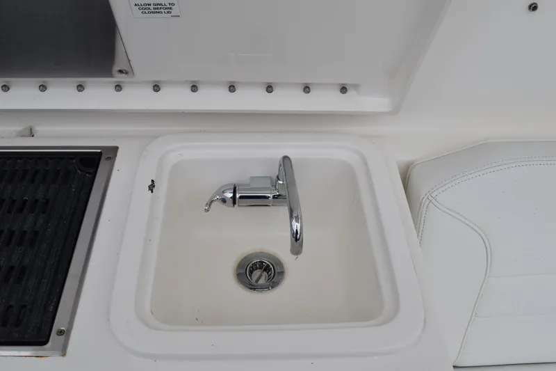  Yacht Photos Pics 2022 Pursuit OS 355 Offshore boat sink and grill area detail.