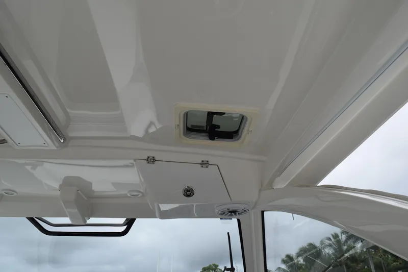  Yacht Photos Pics 2022 Pursuit OS 355 Offshore boat interior ceiling with hatch and speaker.