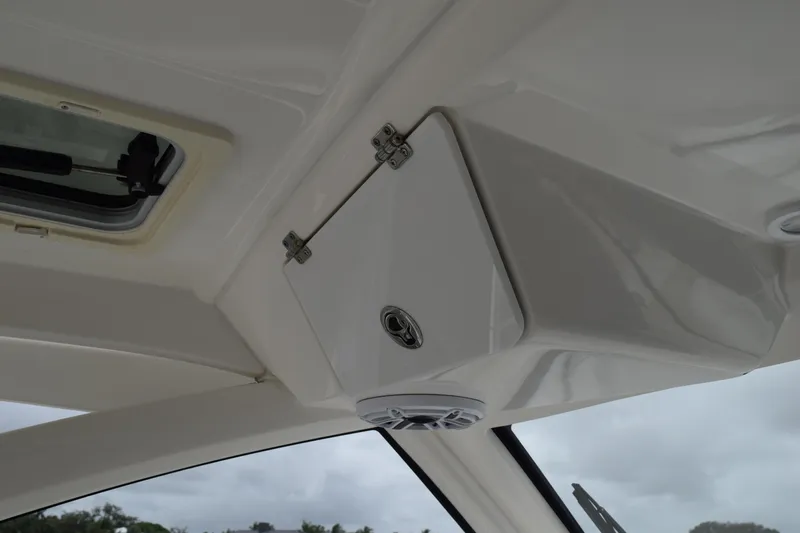  Yacht Photos Pics 2022 Pursuit OS 355 Offshore boat interior ceiling with hatch and speaker.