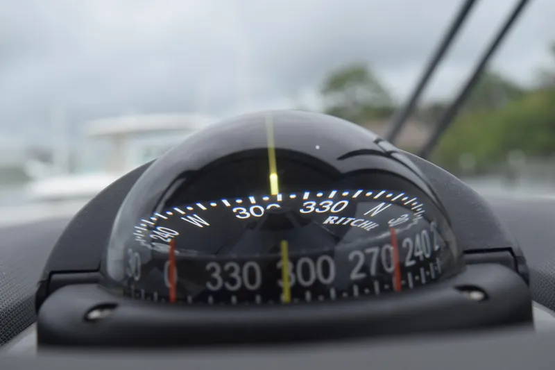  Yacht Photos Pics Compass on 2022 Pursuit OS 355 Offshore boat, showing navigation directions.