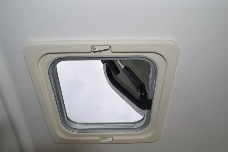  Yacht Photos Pics Hatch window of 2022 Pursuit OS 355 Offshore boat, partially open.