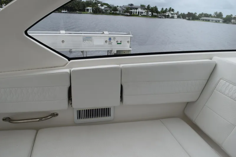  Yacht Photos Pics Interior of 2022 Pursuit OS 355 Offshore boat with white seating and water view.