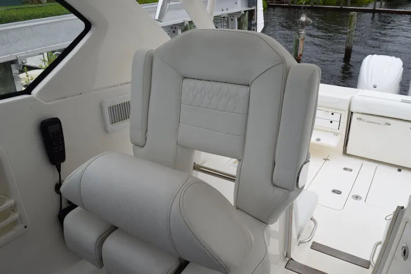  Yacht Photos Pics 2022 Pursuit OS 355 Offshore boat interior with luxurious seating and modern design.