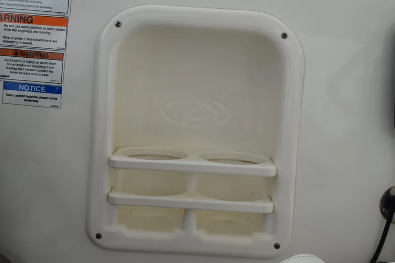  Yacht Photos Pics Cup holder and warning labels on 2022 Pursuit OS 355 Offshore boat.