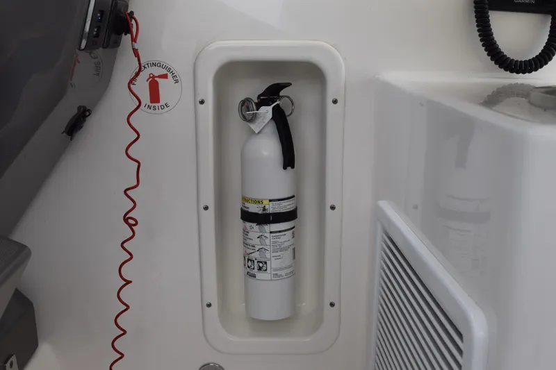  Yacht Photos Pics Fire extinguisher in 2022 Pursuit OS 355 Offshore boat compartment.