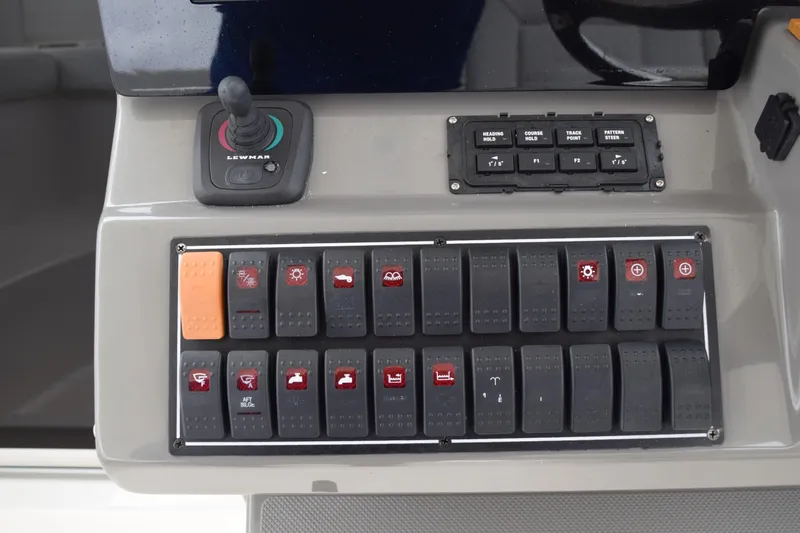  Yacht Photos Pics Control panel of 2022 Pursuit OS 355 Offshore boat with switches and joystick.