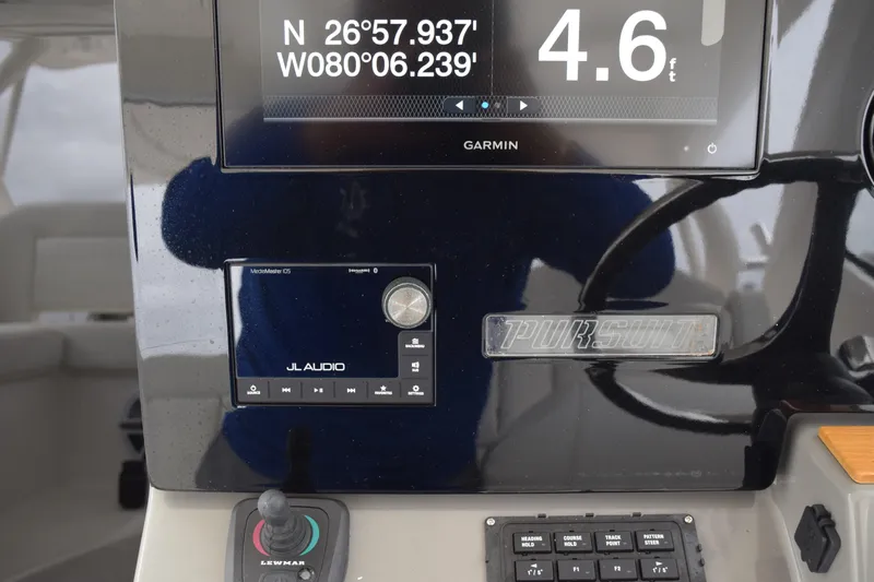  Yacht Photos Pics Control panel of 2022 Pursuit OS 355 Offshore boat with navigation and audio systems.