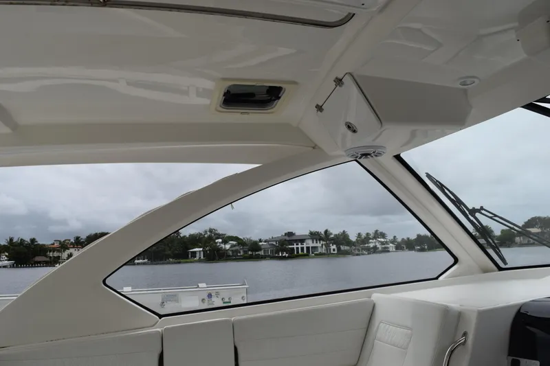  Yacht Photos Pics Interior view of 2022 Pursuit OS 355 Offshore boat with waterfront scenery.