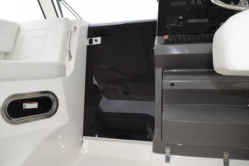  Yacht Photos Pics 2022 Pursuit OS 355 Offshore interior with helm and seating area.