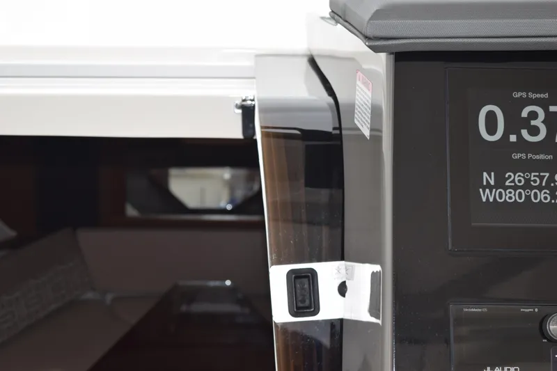  Yacht Photos Pics 2022 Pursuit OS 355 Offshore boat interior with GPS display and cabin view.