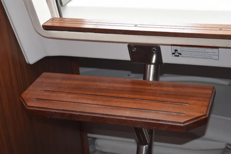  Yacht Photos Pics Wooden step detail on 2022 Pursuit OS 355 Offshore boat interior.