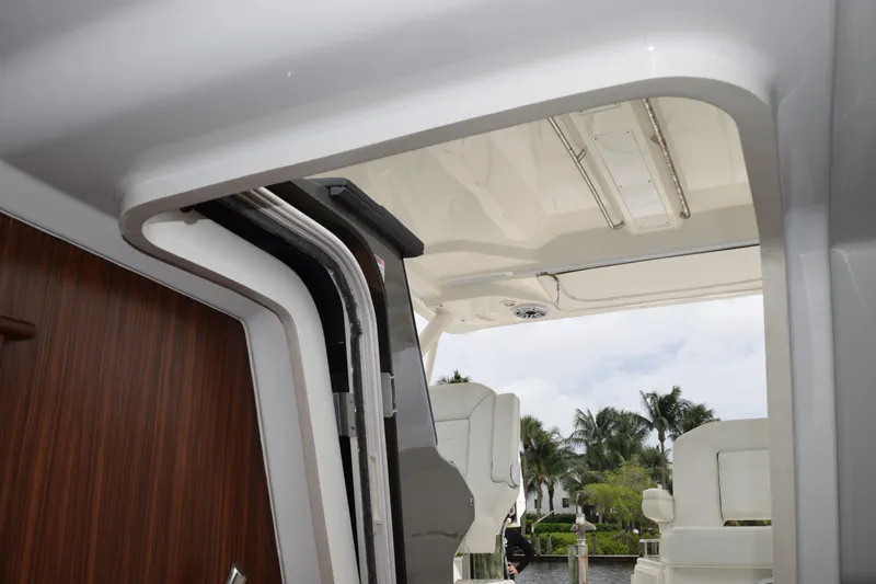  Yacht Photos Pics 2022 Pursuit OS 355 Offshore boat interior with sleek design and seating.