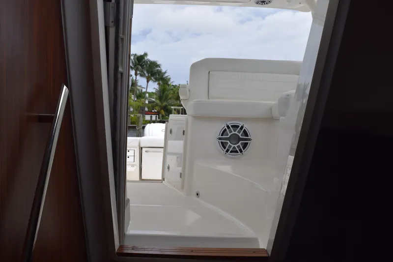  Yacht Photos Pics 2022 Pursuit OS 355 Offshore boat interior view with seating and speaker.