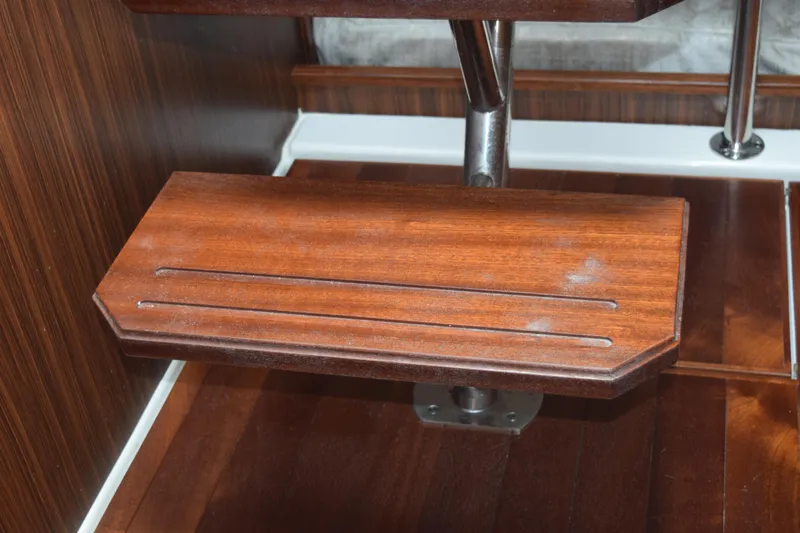  Yacht Photos Pics Wooden step detail on 2022 Pursuit OS 355 Offshore boat interior.