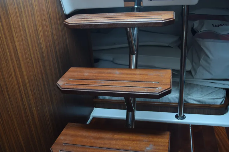  Yacht Photos Pics Wooden interior stairs on a 2022 Pursuit OS 355 Offshore boat.