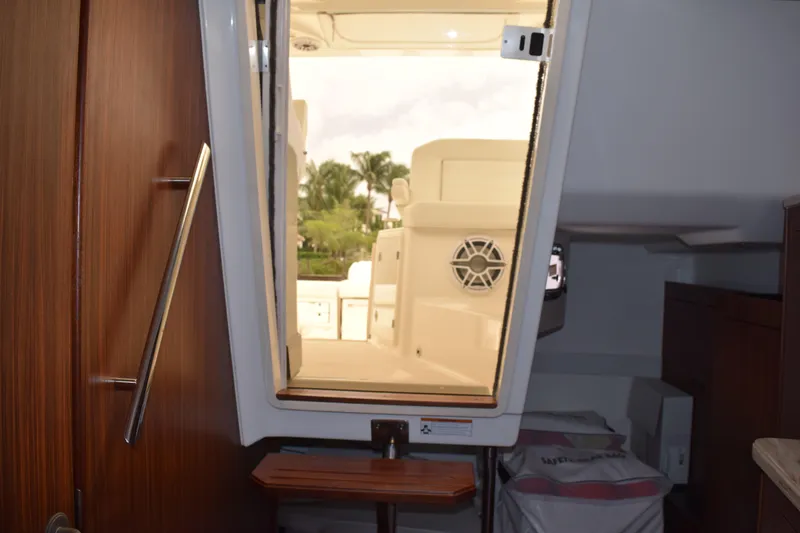  Yacht Photos Pics Interior view of 2022 Pursuit OS 355 Offshore boat cabin with open door.