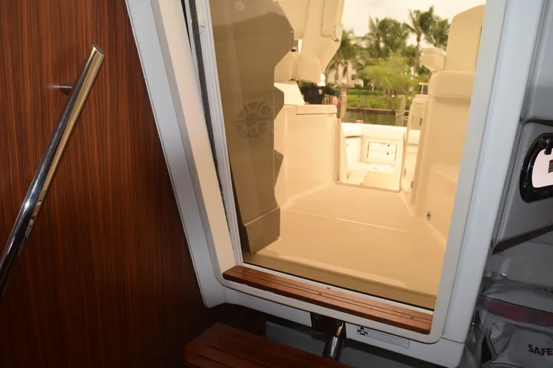  Yacht Photos Pics Interior view of 2022 Pursuit OS 355 Offshore boat, showcasing cabin entrance and deck area.