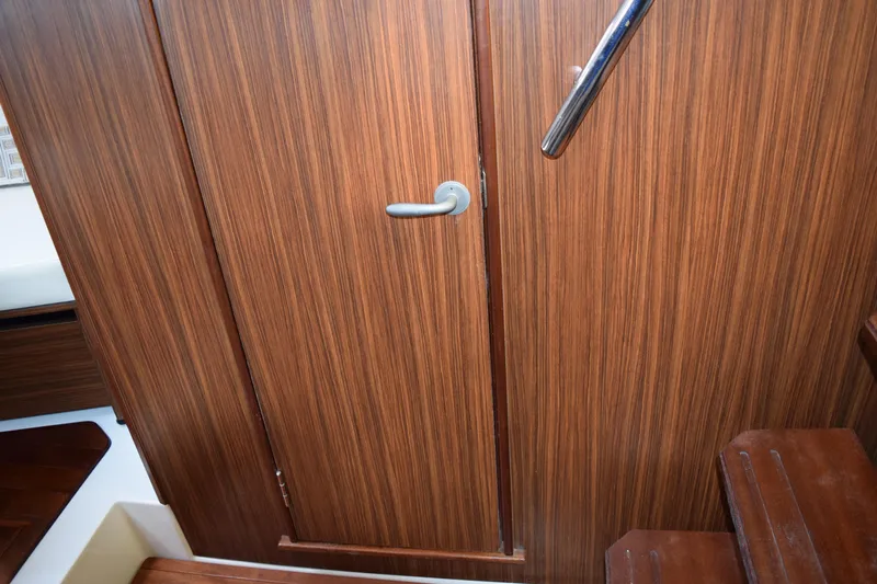  Yacht Photos Pics Wooden interior door with handle on 2022 Pursuit OS 355 Offshore boat.
