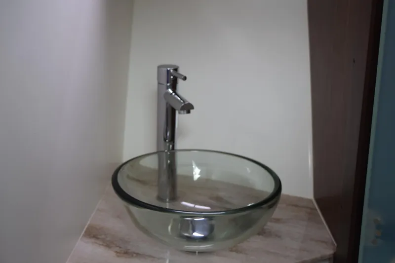  Yacht Photos Pics Glass vessel sink with modern faucet in 2022 Pursuit OS 355 Offshore boat.