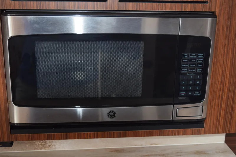  Yacht Photos Pics Stainless steel GE microwave in 2022 Pursuit OS 355 Offshore boat kitchen.