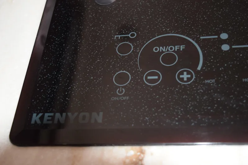  Yacht Photos Pics Control panel of Kenyon cooktop on 2022 Pursuit OS 355 Offshore boat.