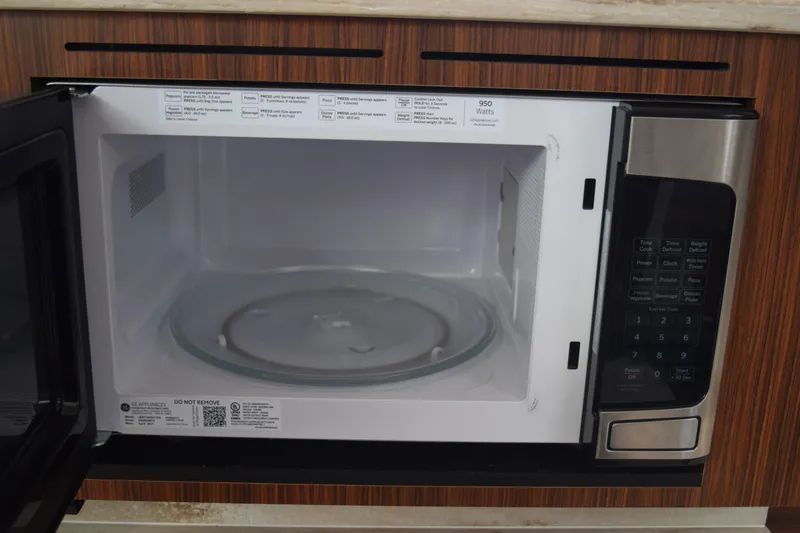  Yacht Photos Pics Open microwave in 2022 Pursuit OS 355 Offshore boat kitchen.