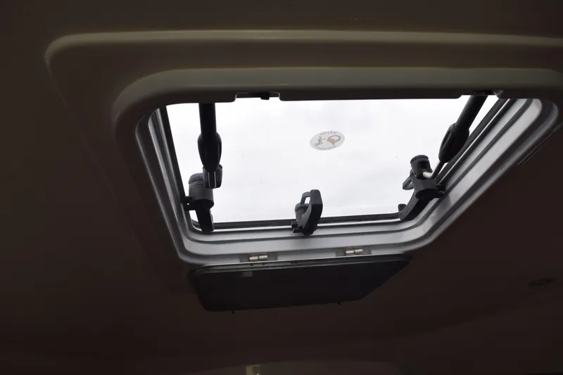  Yacht Photos Pics Open hatch on 2022 Pursuit OS 355 Offshore boat, viewed from interior.