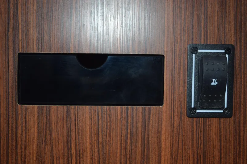  Yacht Photos Pics Wood panel with TV amp switch on 2022 Pursuit OS 355 Offshore boat.