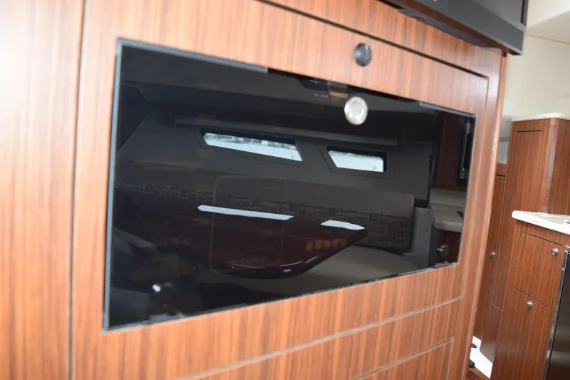  Yacht Photos Pics Interior of 2022 Pursuit OS 355 Offshore yacht with wood finish and modern design.